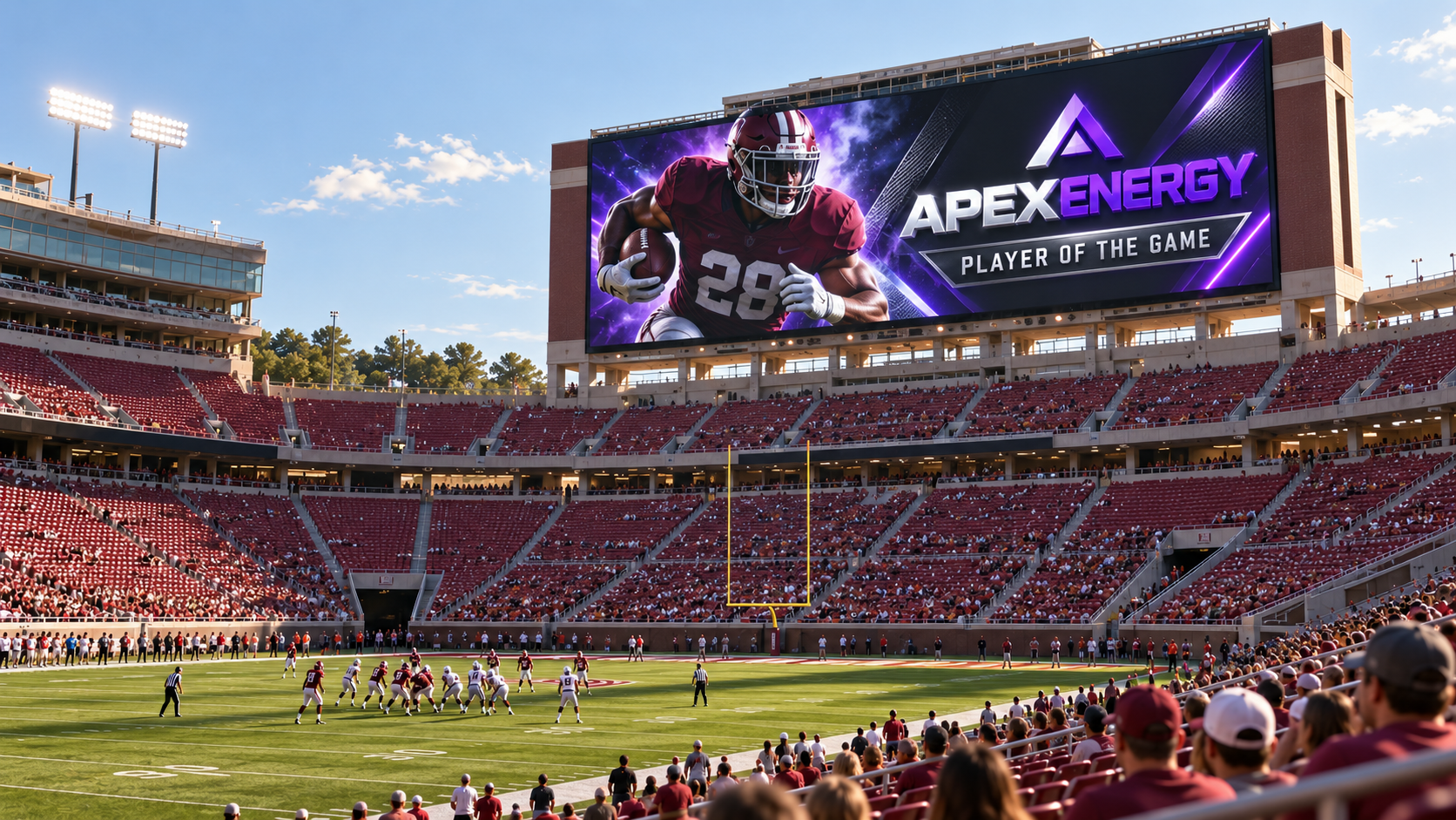 A wide view of a college football stadium on a bright early-season afternoon, seen from low in the stands. The main videoboard is running a sponsor feature graphic: a player in a crimson uniform beside an ApexEnergy wordmark and the line Player of the Game. Around and below the board, large blocks of crimson seats sit empty, with only scattered clusters of fans in the lower bowl. The contrast illustrates a promised sponsor asset that ran as contracted but delivered to a fraction of the audience a later, higher-value date would have provided.